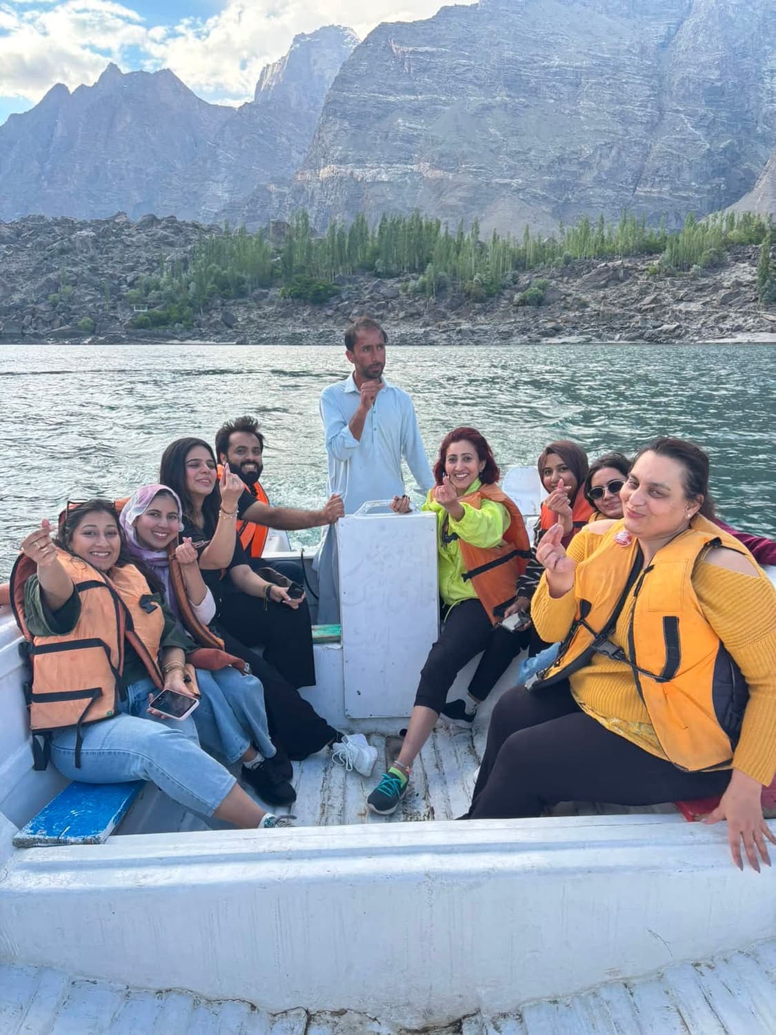 Retreat participants crossing the lake by boat